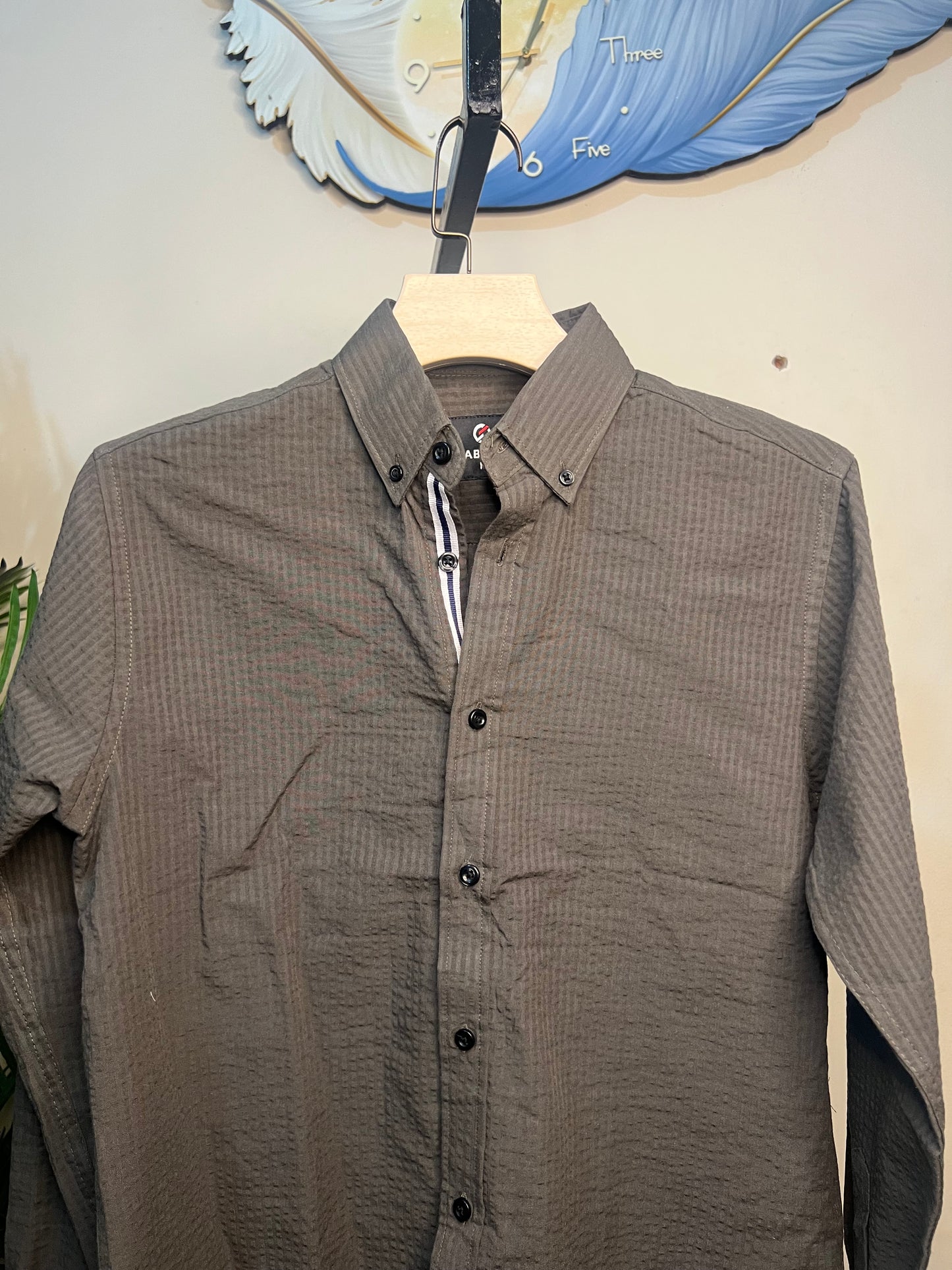 A long-sleeve button-up shirt olive-gray
