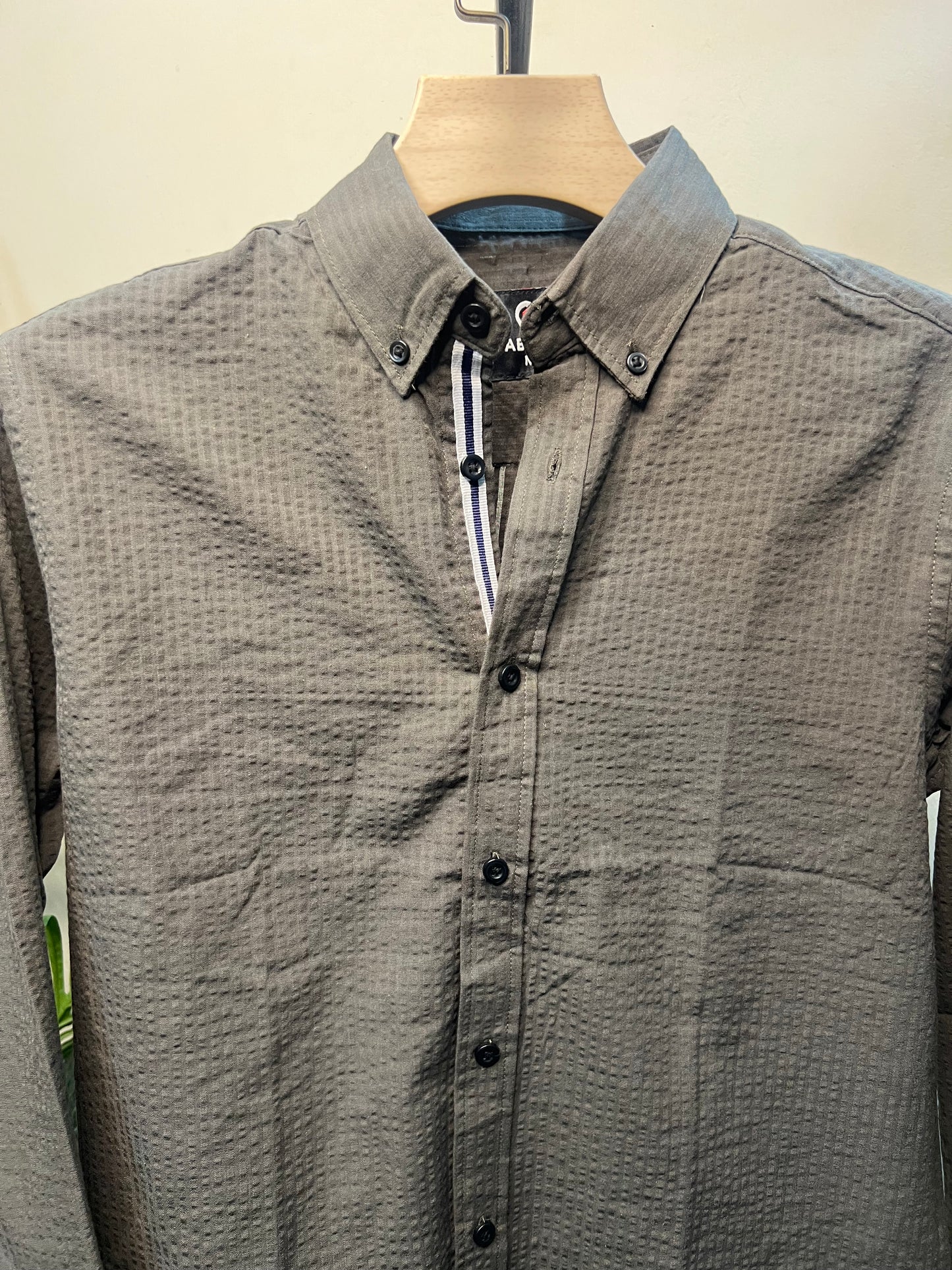 A long-sleeve button-up shirt olive-gray