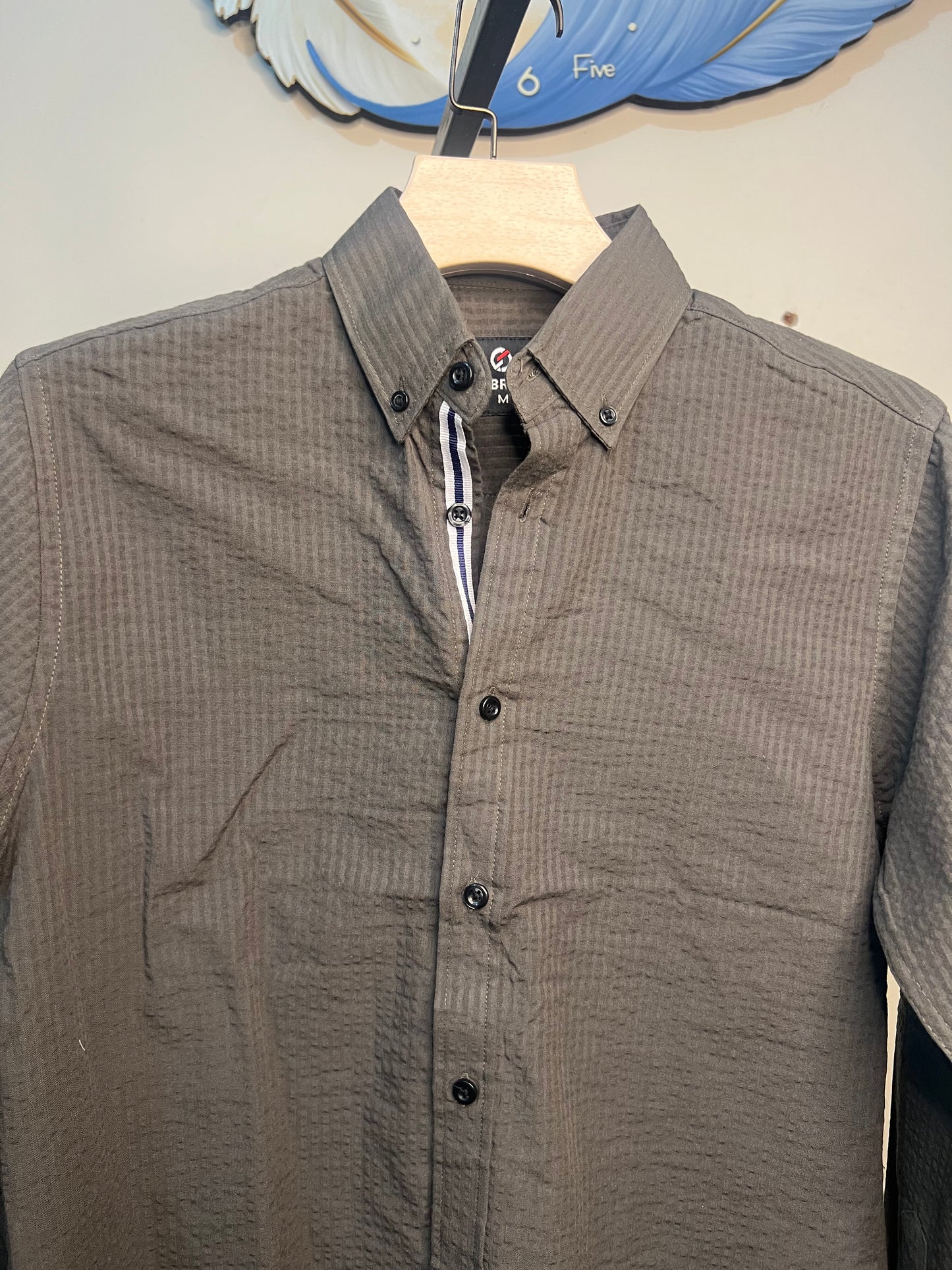 A long-sleeve button-up shirt olive-gray