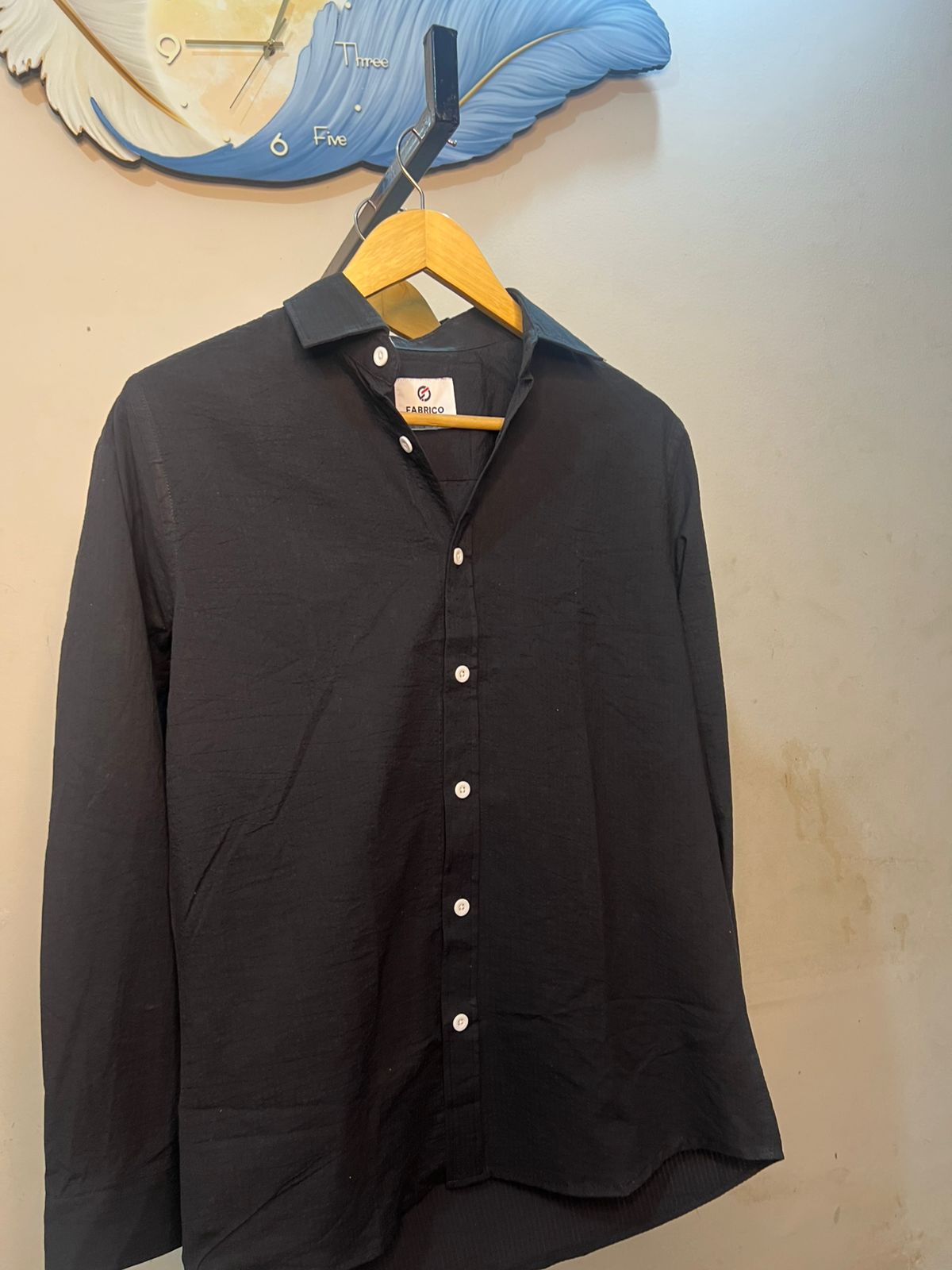A long-sleeve button-up shirt