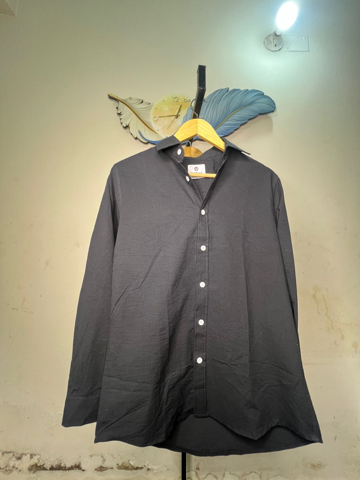 A long-sleeve button-up shirt